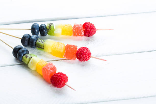 istock Fresh summer fruits on wooden background. Studio shot 1162712312