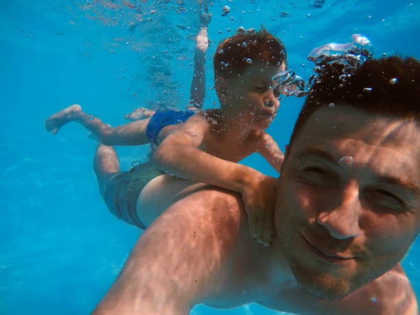 istock Father and son diving 1162712950