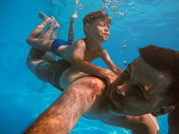 istock Father and son diving 1162713147