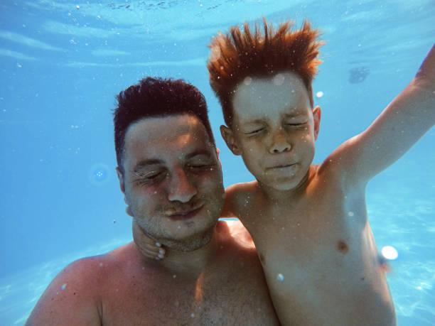 istock Father and son diving 1162713160