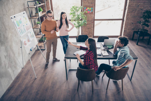 istock Above high angle view of nice guys professional trainee employees presenting result analyse data ask questions classes course coach coacher table at industrial loft interior workplace workstation 1162713168