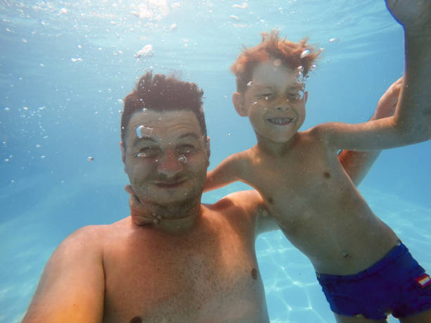 istock Father and son diving 1162713774