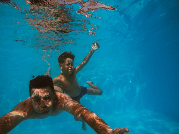 istock Father and son diving 1162713803