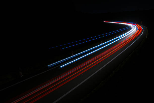 istock lights of cars with night 1162714199