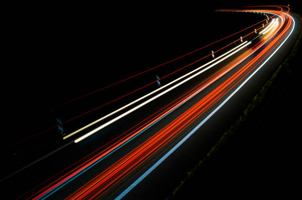 istock lights of cars with night 1162714320