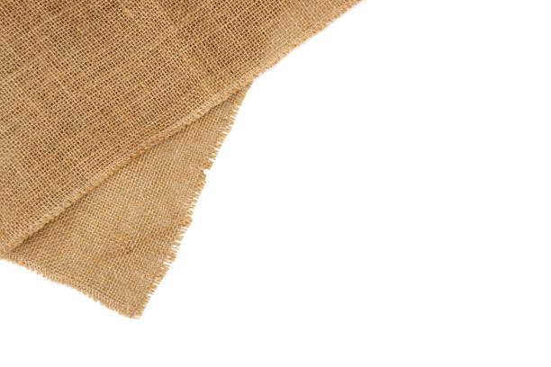 Rustic brown burlap cloth. Rustic brown burlap cloth, isolated on white background. hessian texture stock pictures, royalty-free photos & images