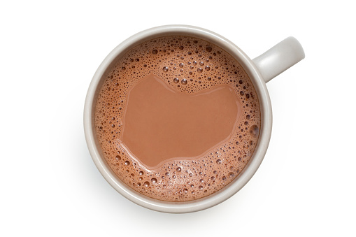 Chocolate caliente en una taza de cerámica gris aislada sobre blanco desde arriba. photo