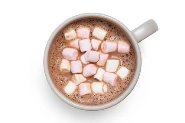 Hot chocolate with small pink and white marshmallows in a grey ceramic mug isolated on white from above.