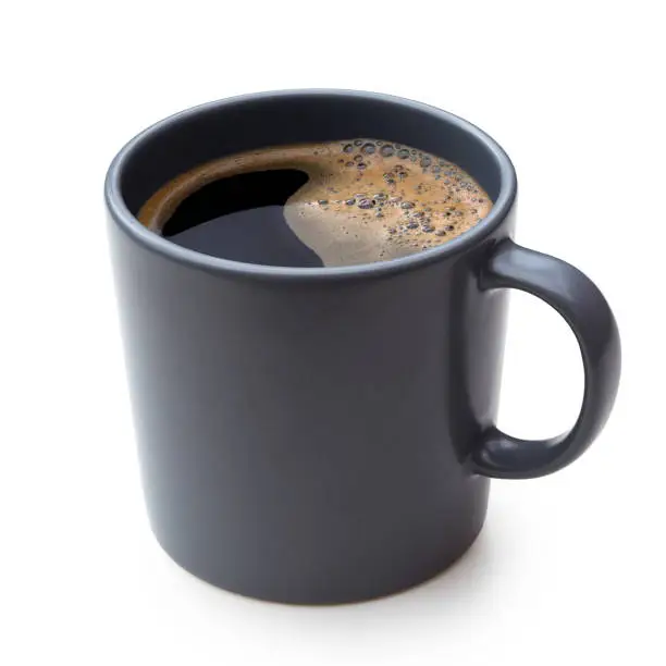 Photo of Black coffee in a blue-grey ceramic mug isolated on white.