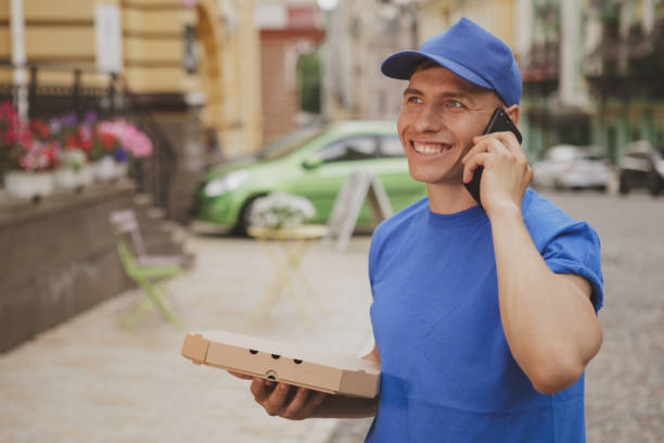istock Handsome young deliveryman working in the city 1162718328