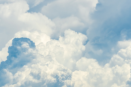 Beautiful white fluffy cloud abstract background. Cloudscape.  Fluffy white clouds on sunny day. Nature weather. Soft like cotton texture of cloud. Puffy clouds. Wish and peaceful concept. Sunshine.