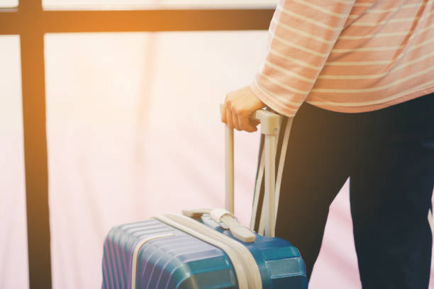 istock Women dragging bag for travel 1162723875