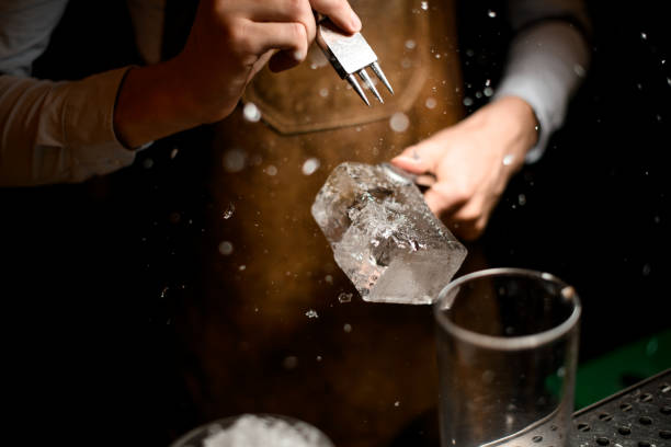 istock Male bartender making a crushed with a special instrument 1162725054