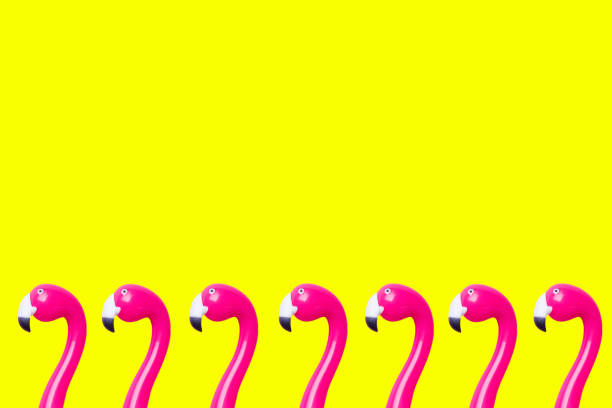 istock Pink pen Flamingo on a yellow background. Copy space Flat lay. 1162725071
