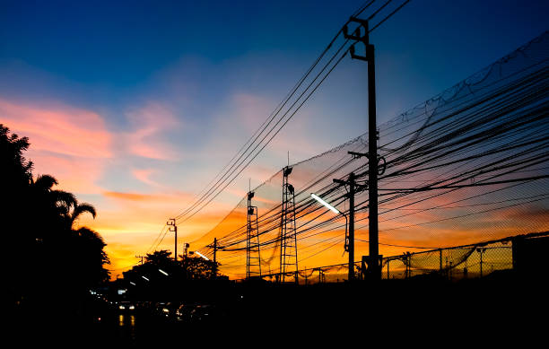 istock Dramatic sky with silhouette of electricity pole and wire 1162725157