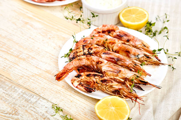 istock Grilled big tiger shrimps prawns on white plate 1162725255