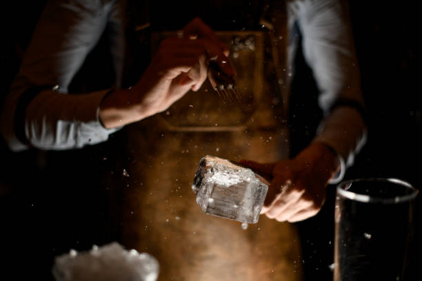 istock Professional bartender in leather apron making a crushed with a special instrument 1162725996