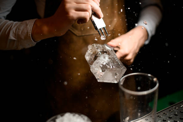 istock Professional male bartender making a crushed with a special instrument 1162726780