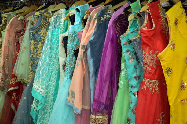 istock Beautiful multicolor designer dresses hanging in market fluorescent colours 1162729149
