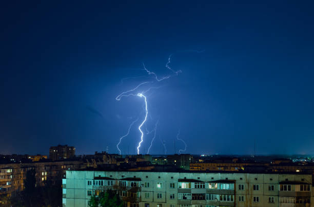 istock Thunderstorm with lightning and thunder over the night city 1162731172