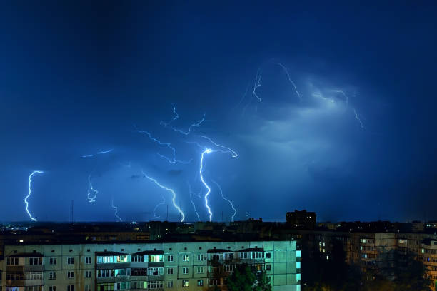istock Thunderstorm with lightning and thunder over the night city 1162731175