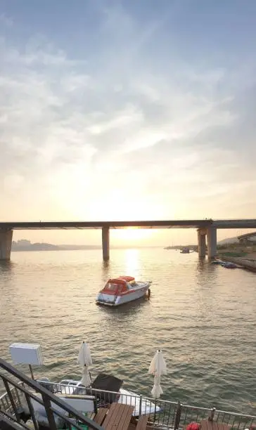 Sunset view of the Hanriver in Seoul, South Korea. The speedboat is floating on the river. This picture was taken on the floating  resturant.