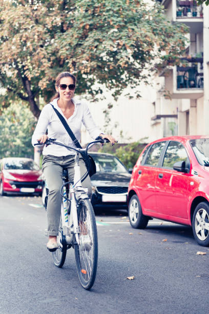 istock Woman Riding Bicycle On Road 1162737244