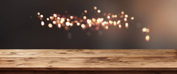 istock Lights in the dark with wooden counter 1162737261