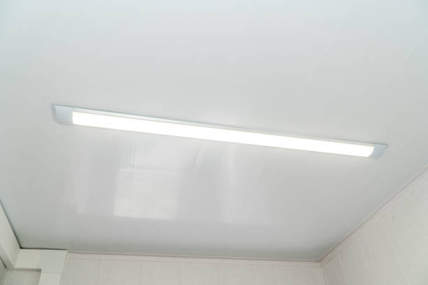 istock Bright chandelier on a white metal ceiling 1162742194