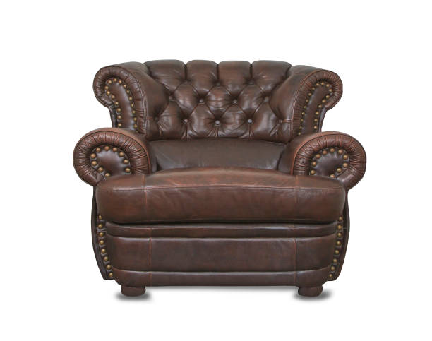 istock Old vintage brown leather chair in empty room 1162743204