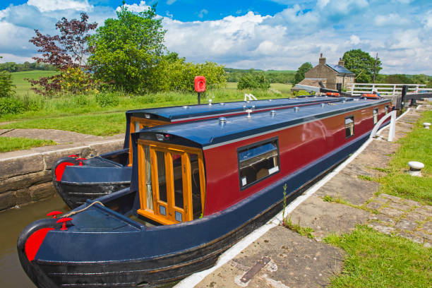 istock Narrowboats in a lock on a British canal in rural setting 1162743551