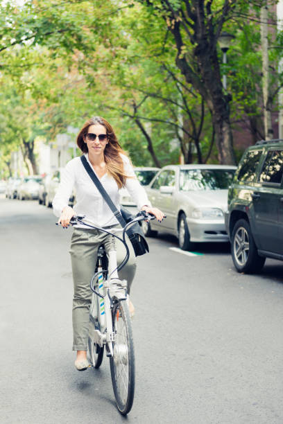 istock Woman Riding Bicycle On Road 1162746347