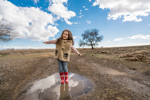 Cute little girl child playing on the field