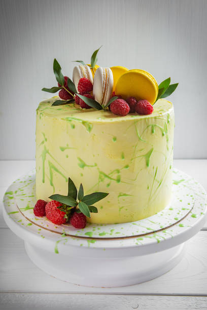 istock Matcha Green tea cake with macaroon raspberries decorated with green leaves 1162751654