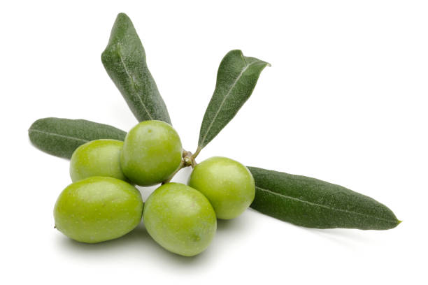 istock Green olives with leaves isolated on white 1162751899
