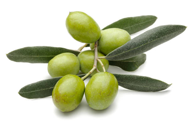 istock Green olives with leaves isolated on white 1162752282