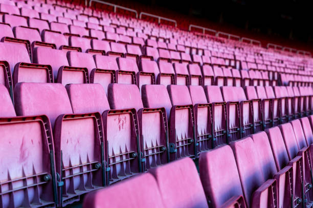 istock Vacant red chairs of stadium stand 1162753447