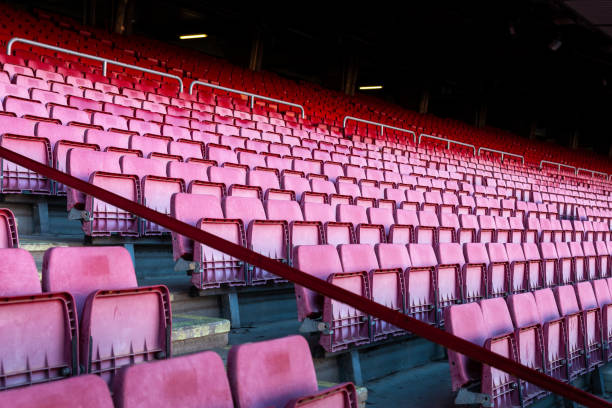 istock Vacant red chairs of stadium stand 1162753537