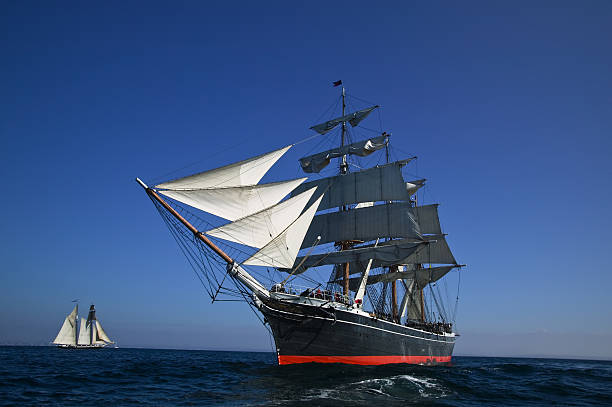 Sailing at sea under full sail stock photo