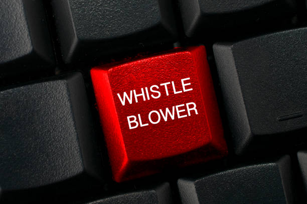 Whistleblowing concept: Black keyboard with a red key and the whistleblower word Whistleblowing concept: Black keyboard with a red key and the whistleblower word cristian stock pictures, royalty-free photos & images