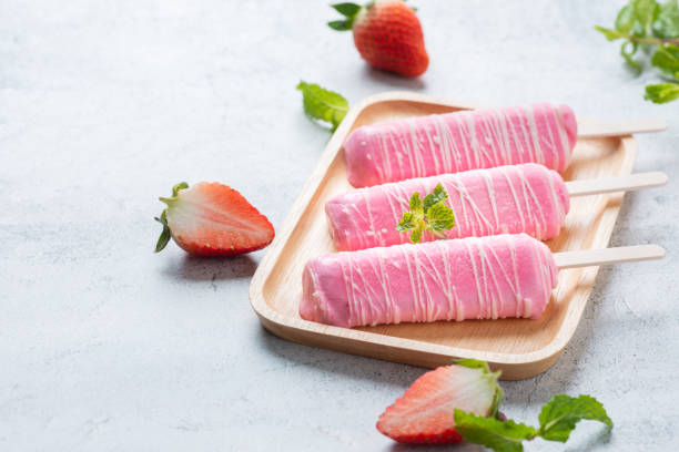 istock Ice cream strawberry milk stick, covered with milk. 1162760448