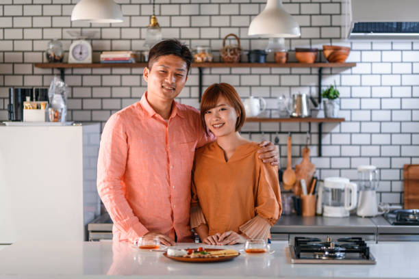 istock Young Japanese Couple in Kitchen with Tea and Light Lunch 1162761128