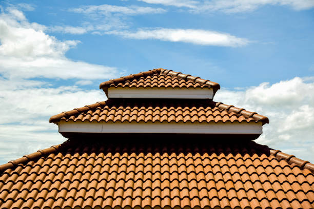 istock tiles roof on new house with blue sky 1162761696