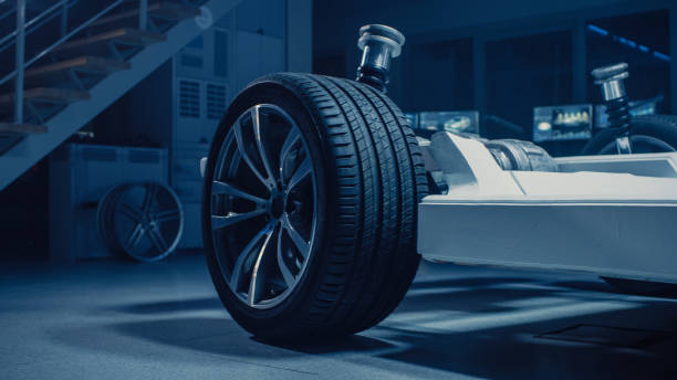 istock Shot of Automobile Concept: Authentic Electric Car Platform Chassis. Hybrid Frame Include: Wheels, Engine, Brakes and Battery. In Innovative Automotive Design Facility. Focus on Wheel. 1162762143