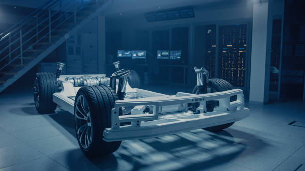 istock Concept of Authentic Electric Car Platform Chassis Prototype Standing in Industrial Machinery Design Laboratory. Hybrid Axel Frame include Wheels, Suspension, Engine, Brakes and Battery. 1162762291