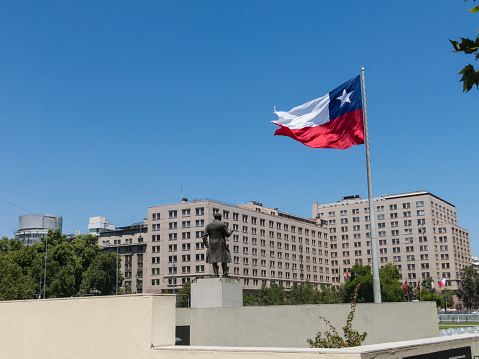 The giant flag on Avenida La Alameda with the citizenship Square, in downtown Santiago de Chile. Chile.