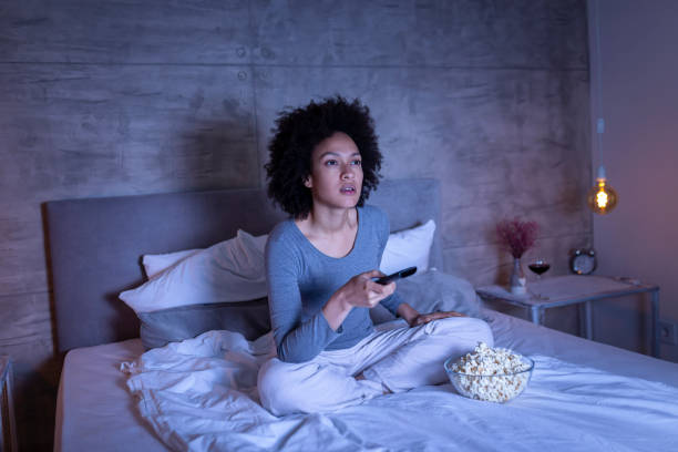 istock Woman changing channels on TV 1162767481