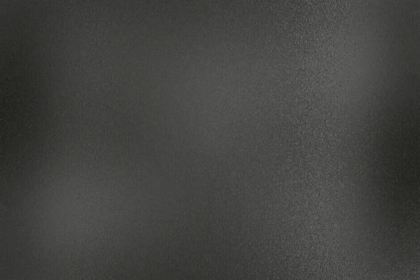 istock Dirty old black rough metal wall, abstract texture background 1162768086