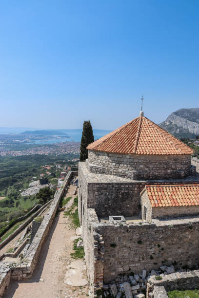 istock Klis fortress panoramic view with clear bly sky on a summer day, Split, Croatia. 1162769292