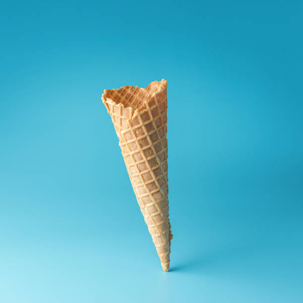 istock Ice cream cone on blue background. Minimal summer concept. 1162772130